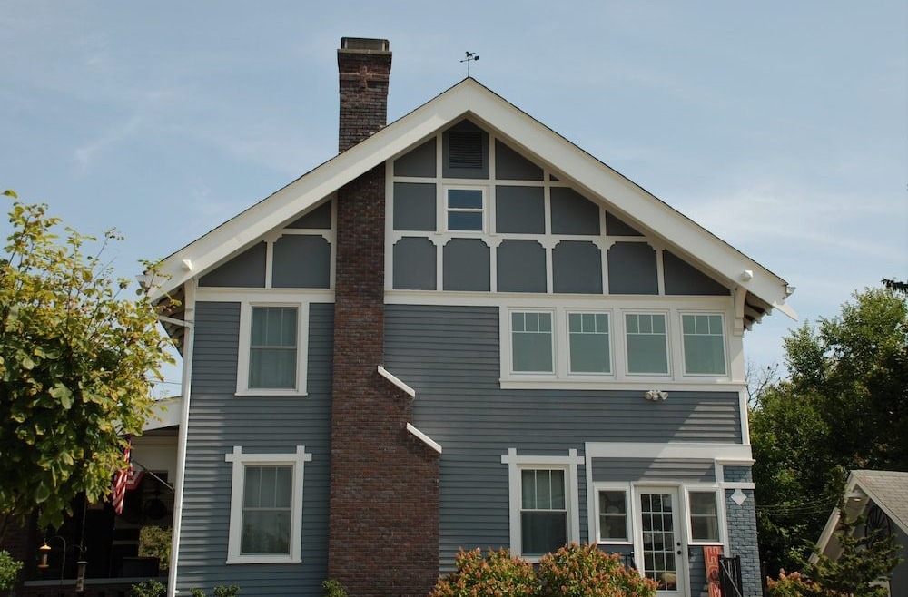  A gray and white home with windows 